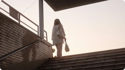 woman walking up a flight of stairs