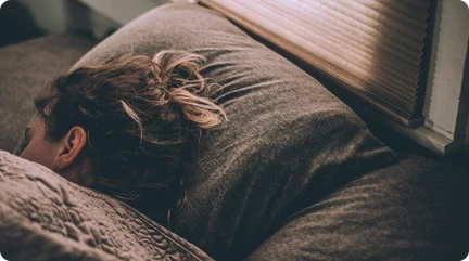 woman sleeping on a bed