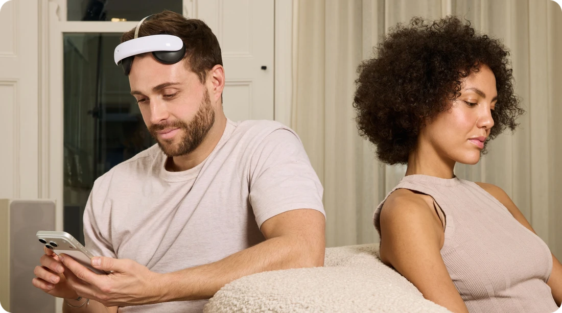 man using the flow headset next to a woman